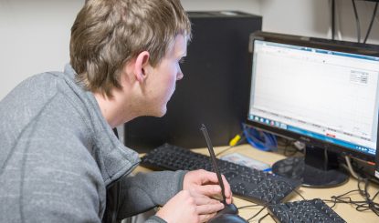 student-researcher studying computer models